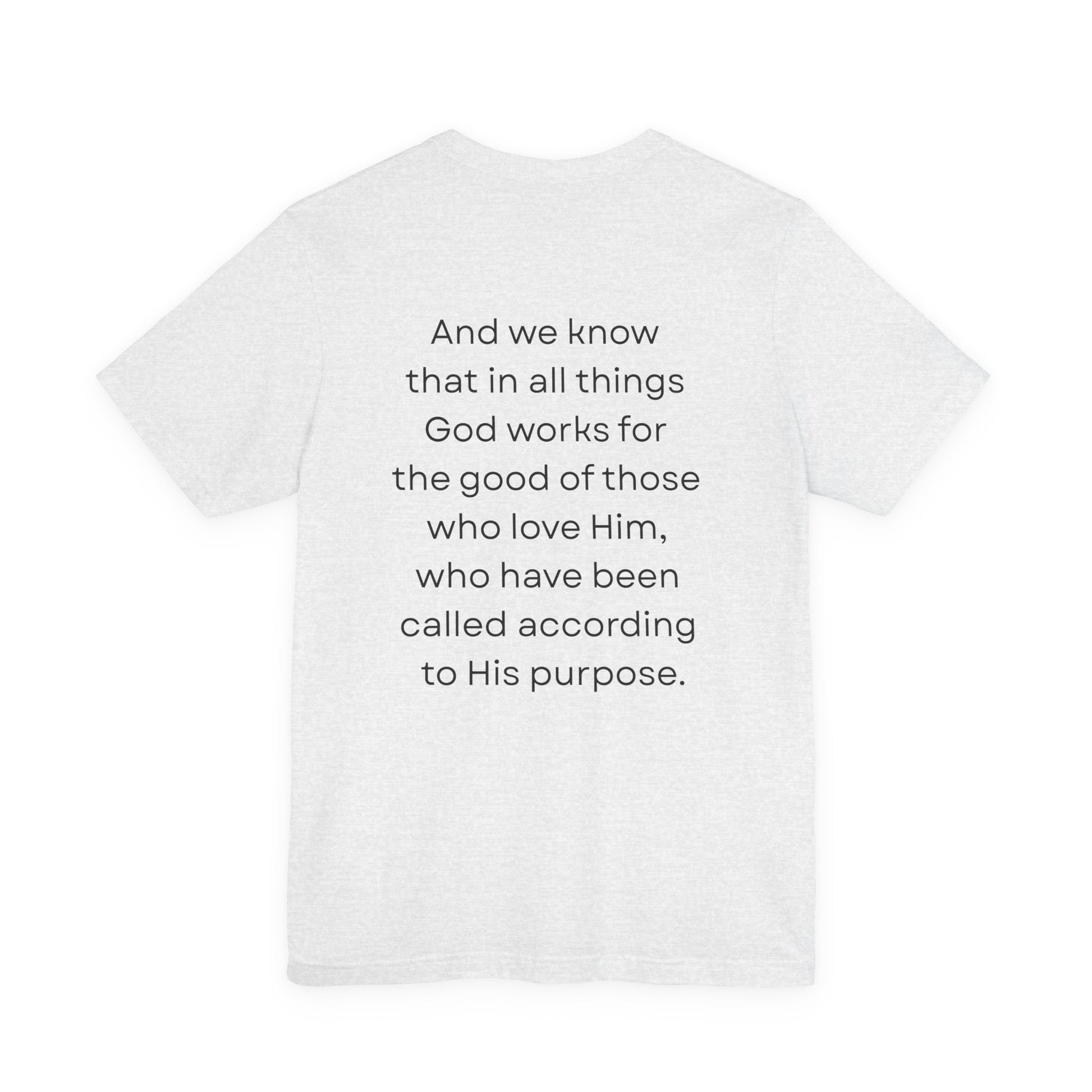 White t-shirt with black verse on a white background. Romans 8:28