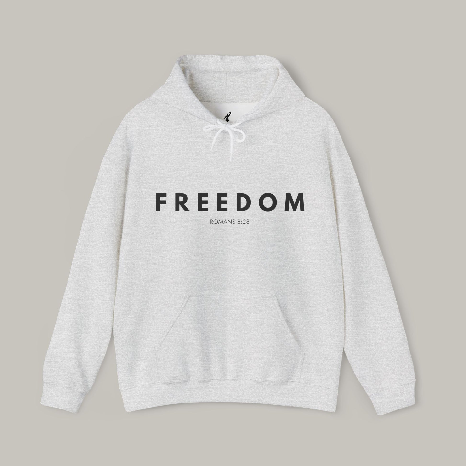 Gray hoodie with 'FREEDOM' text on a beige background