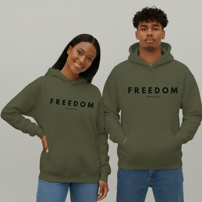 Two people wearing green 'FREEDOM' hoodies on a gray background