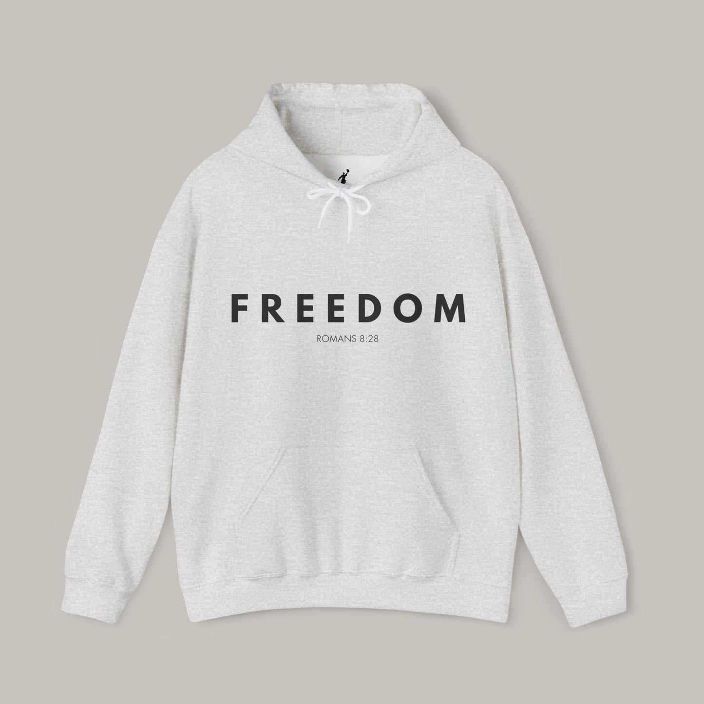 Gray hoodie with 'FREEDOM' text on a beige background