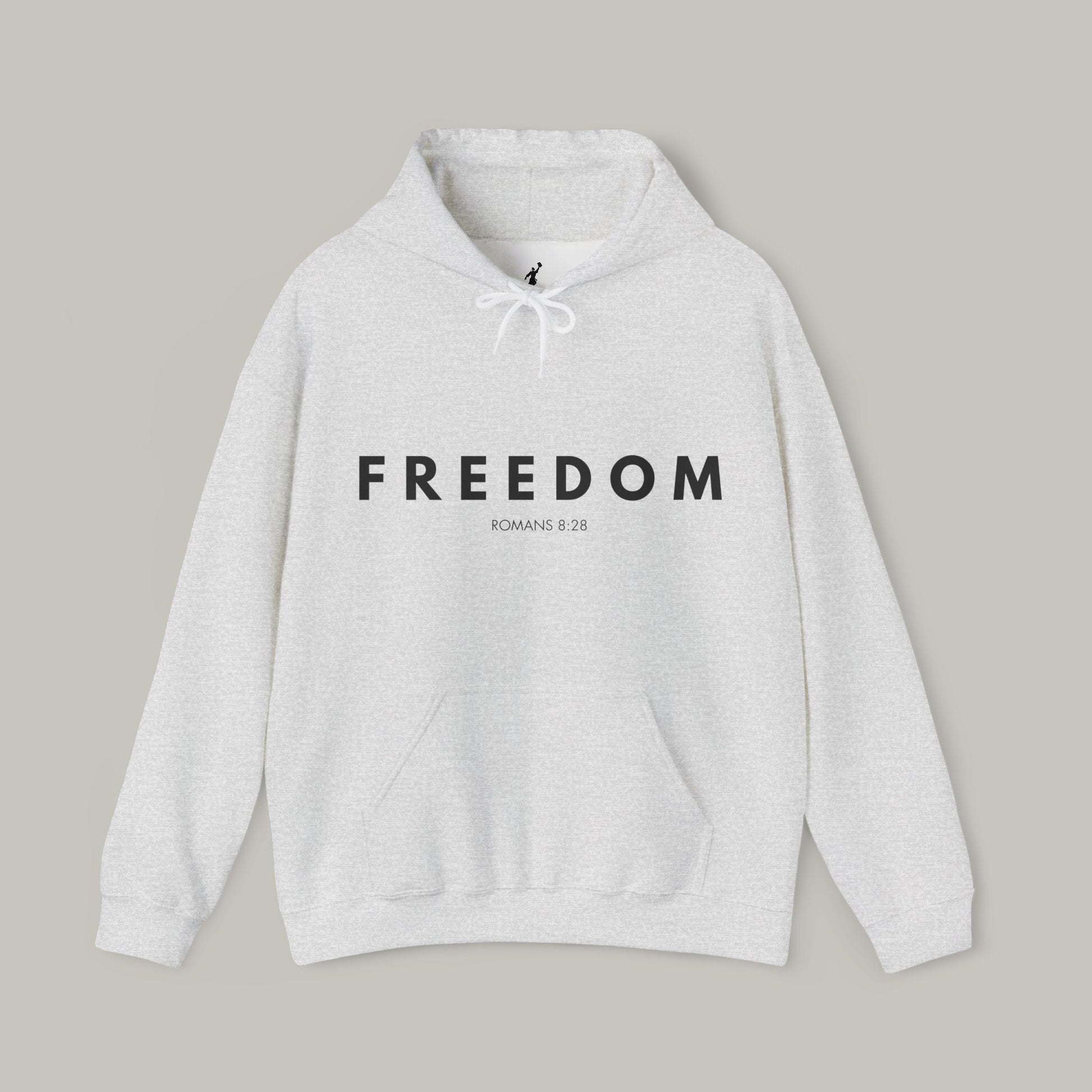 Gray hoodie with 'FREEDOM' text on a beige background