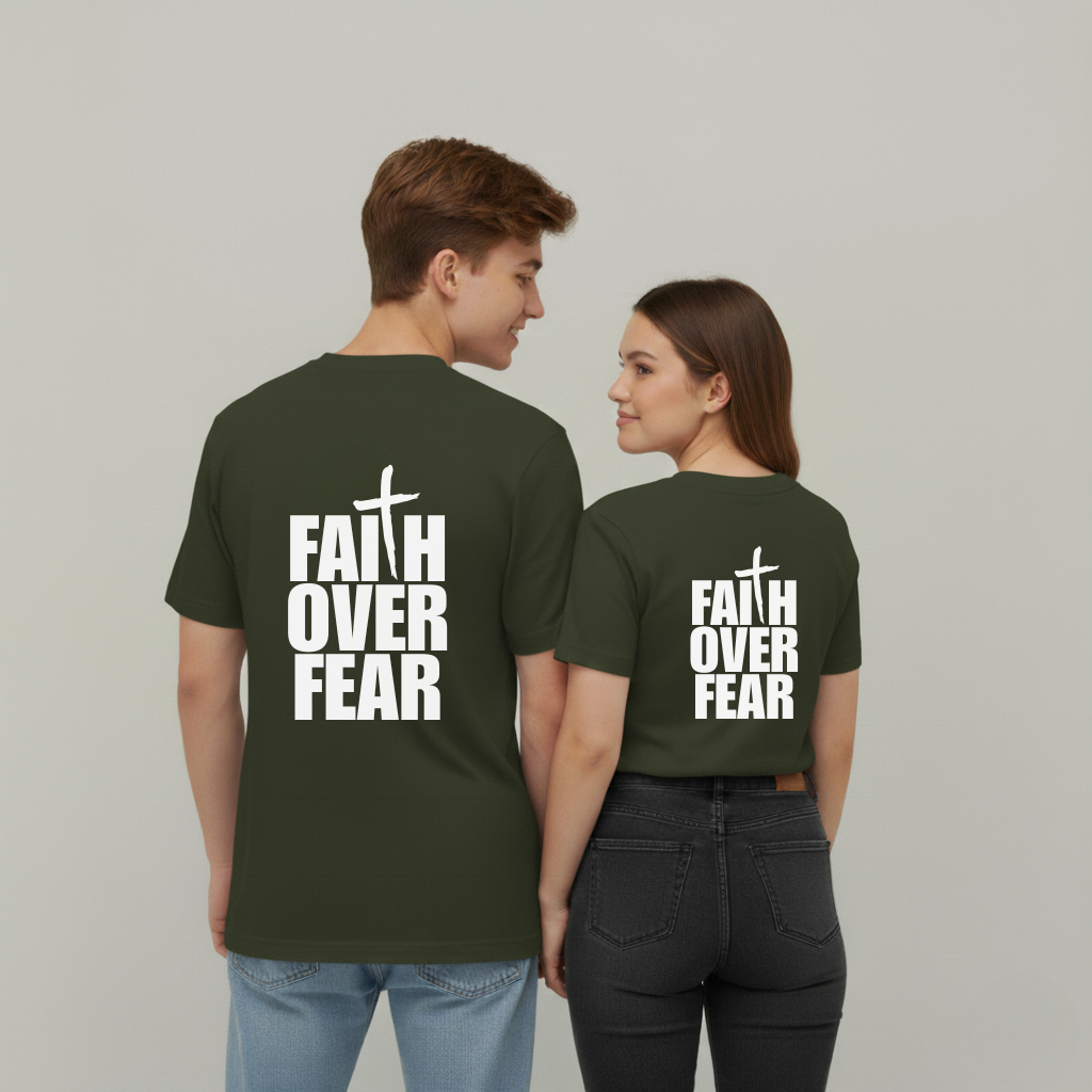 Two people wearing green t-shirts with 'Faith Over Fear' text on a plain background