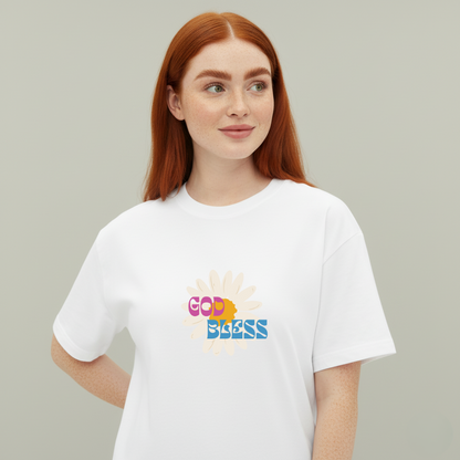 Person wearing a white t-shirt with colorful text and graphics on a plain background