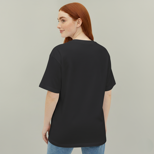 Person wearing a black t-shirt on a plain background