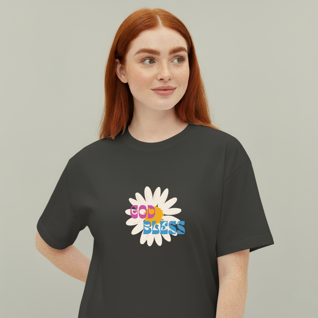 Person wearing a black t-shirt with a colorful flower design and 'God Bless' text on a plain background