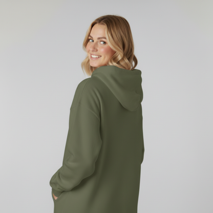 Woman wearing a green hoodie against a plain background