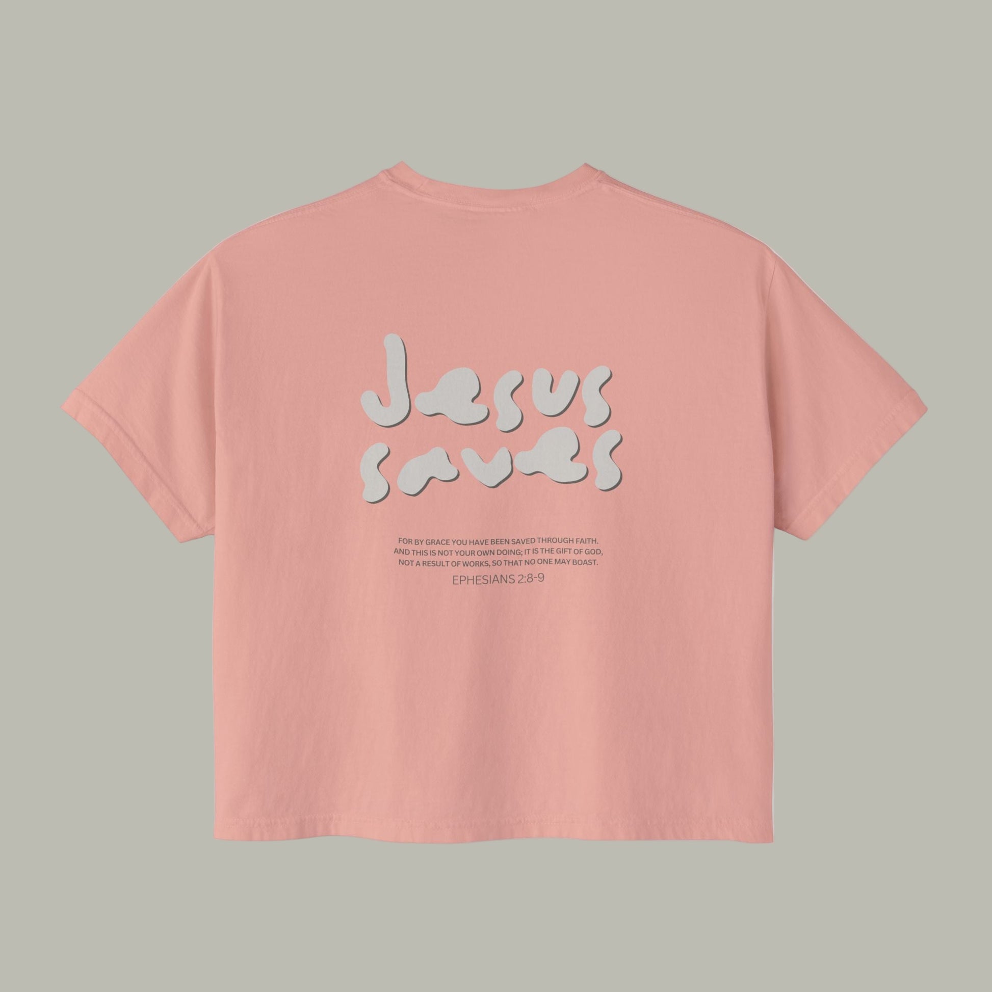 Pink t-shirt with 'Jesus saves' text on a white background