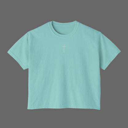 Light blue t-shirt with a cross design on a white background