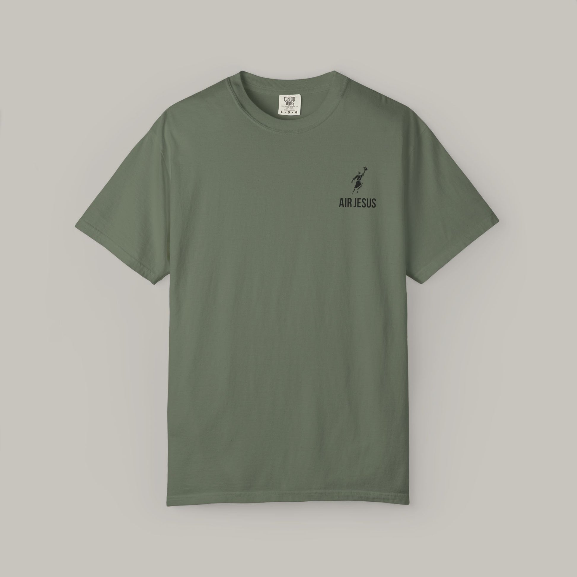 Green t-shirt with a small logo on a gray background
