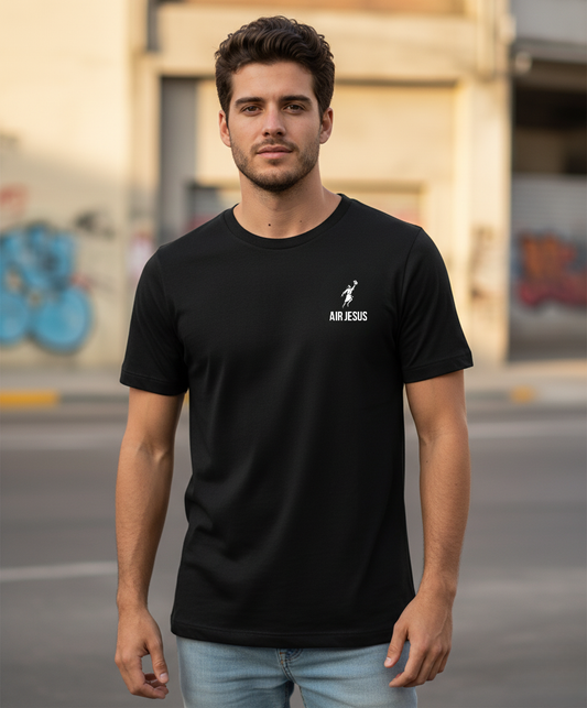 Man wearing a black t-shirt with 'Air Jesus' logo and text, standing on a street.
