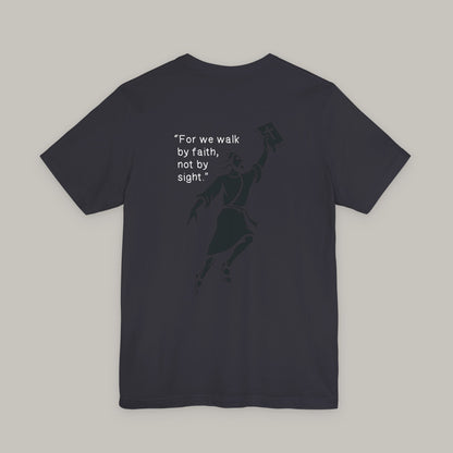 Black t-shirt with a silhouette and text on the back against a gray background